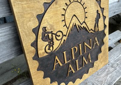 Logo Firmenschild Hausschild Symbol Alpina Alm vertieft dunkel